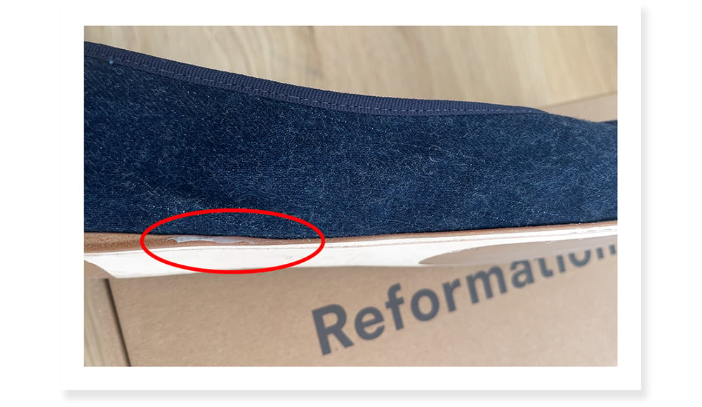 Showing Reformation shoe quality with like loose glue 