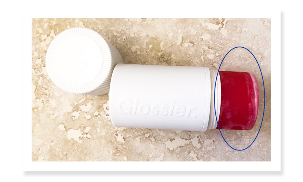 Photo showing how Glossier's deodorant melts after applying