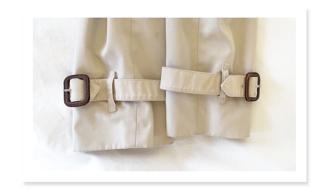 Buckles showing light wear on a 10+ year old Burberry trench coat