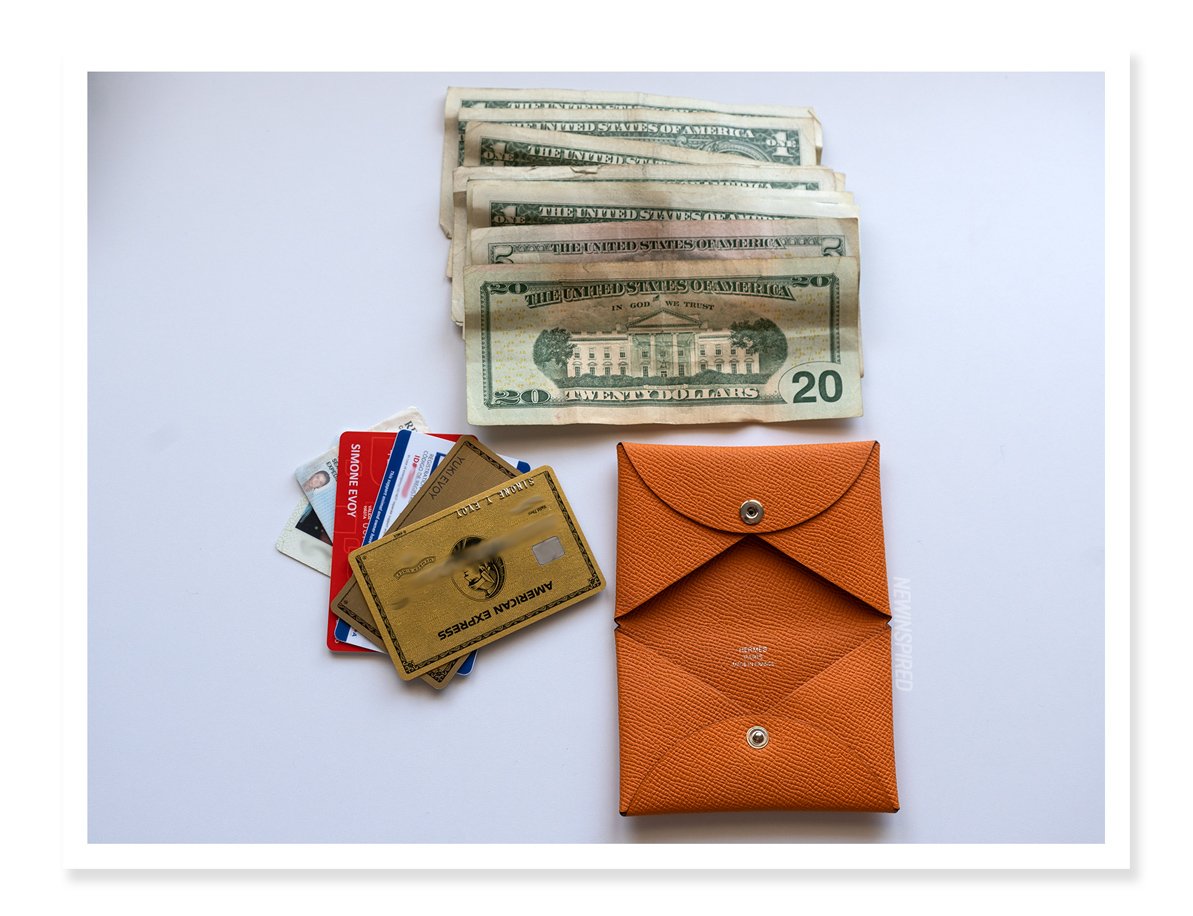 Showing $36 in cash and 7 credit cards/ID cards in the Hermès Calvi card case