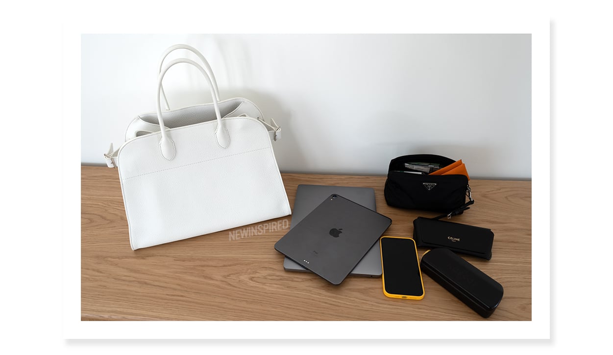A 13" MacBook, iPad Pro, phone, sunglasses case, eyeglasses case, pouch with necessities all fit in the Margaux 15 bag