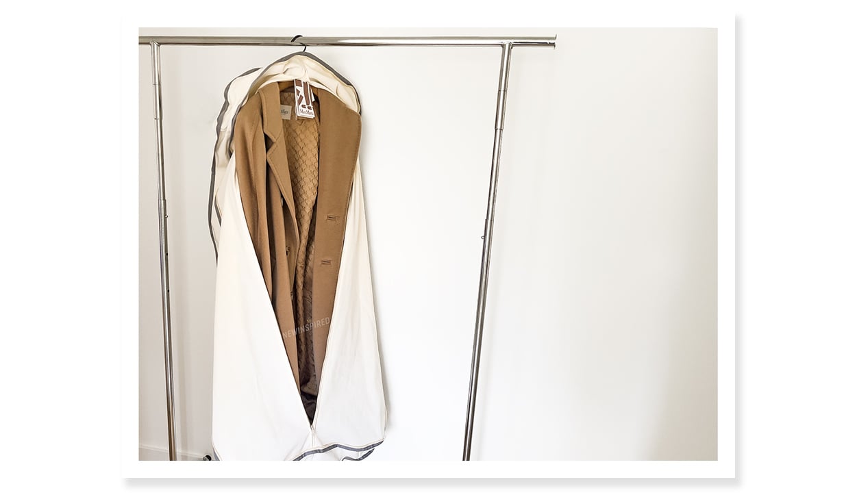 Max Mara Madame Icon coat in the garment bag and hanger that it comes with